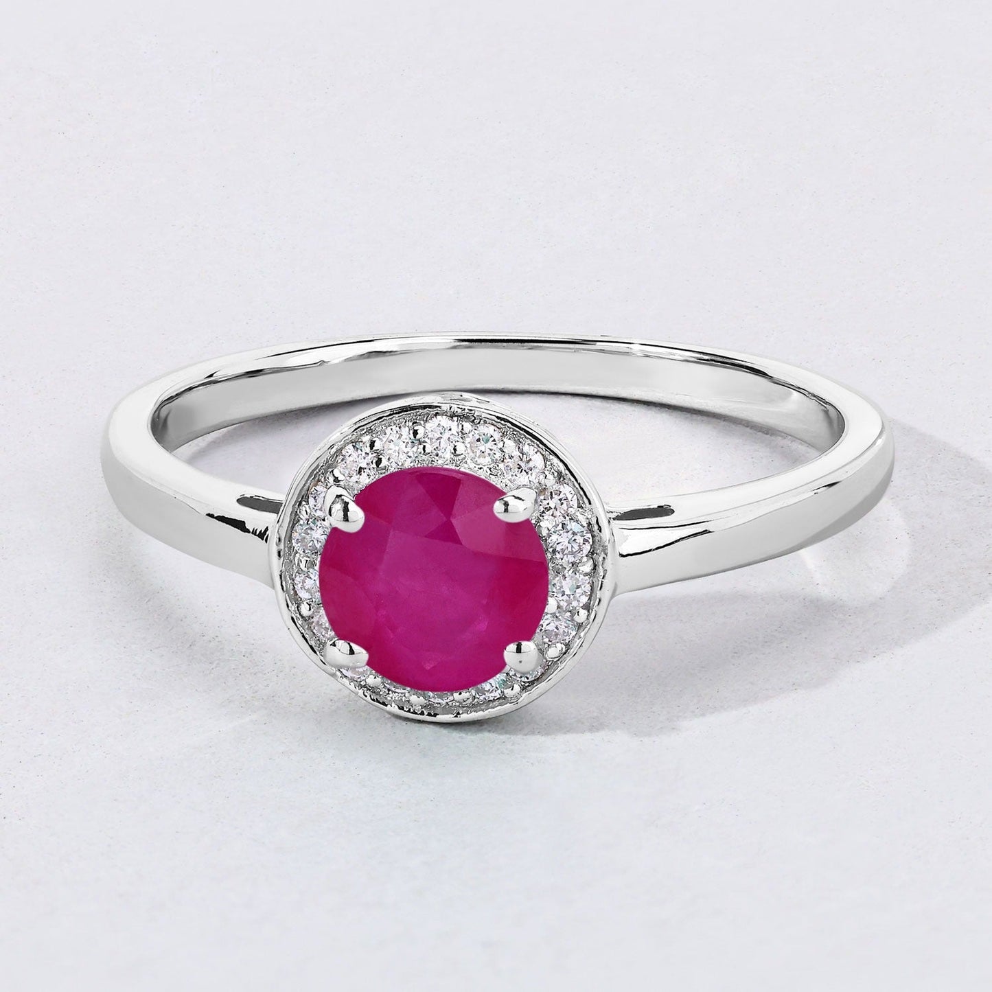 0.55 Ct Round Pink Mozambique Ruby & Lab Diamond Prong Silver Halo Ring