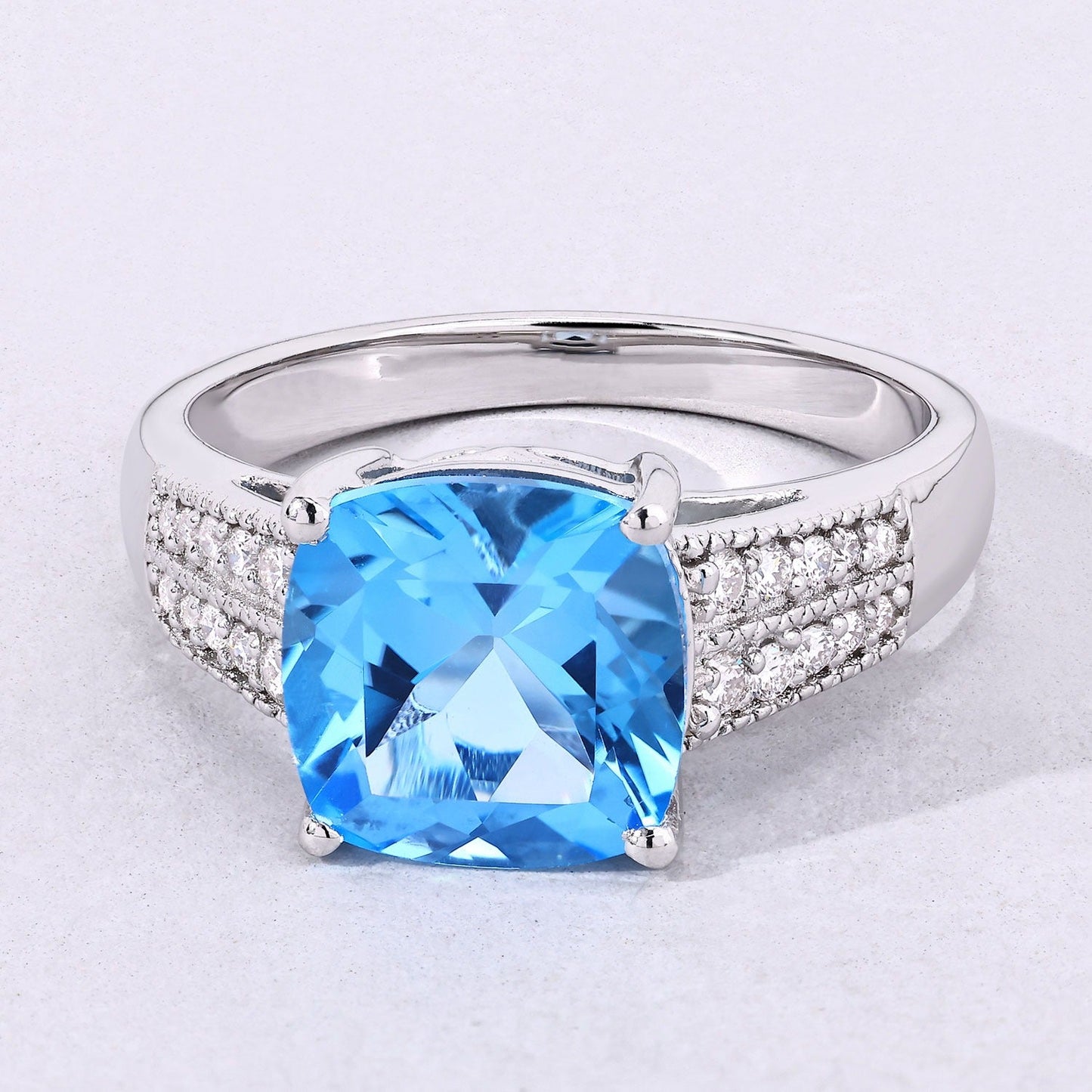 3.40 Ct Cushion Swiss Blue Topaz and Lab Diamond Prong Silver Pave Bridge Ring