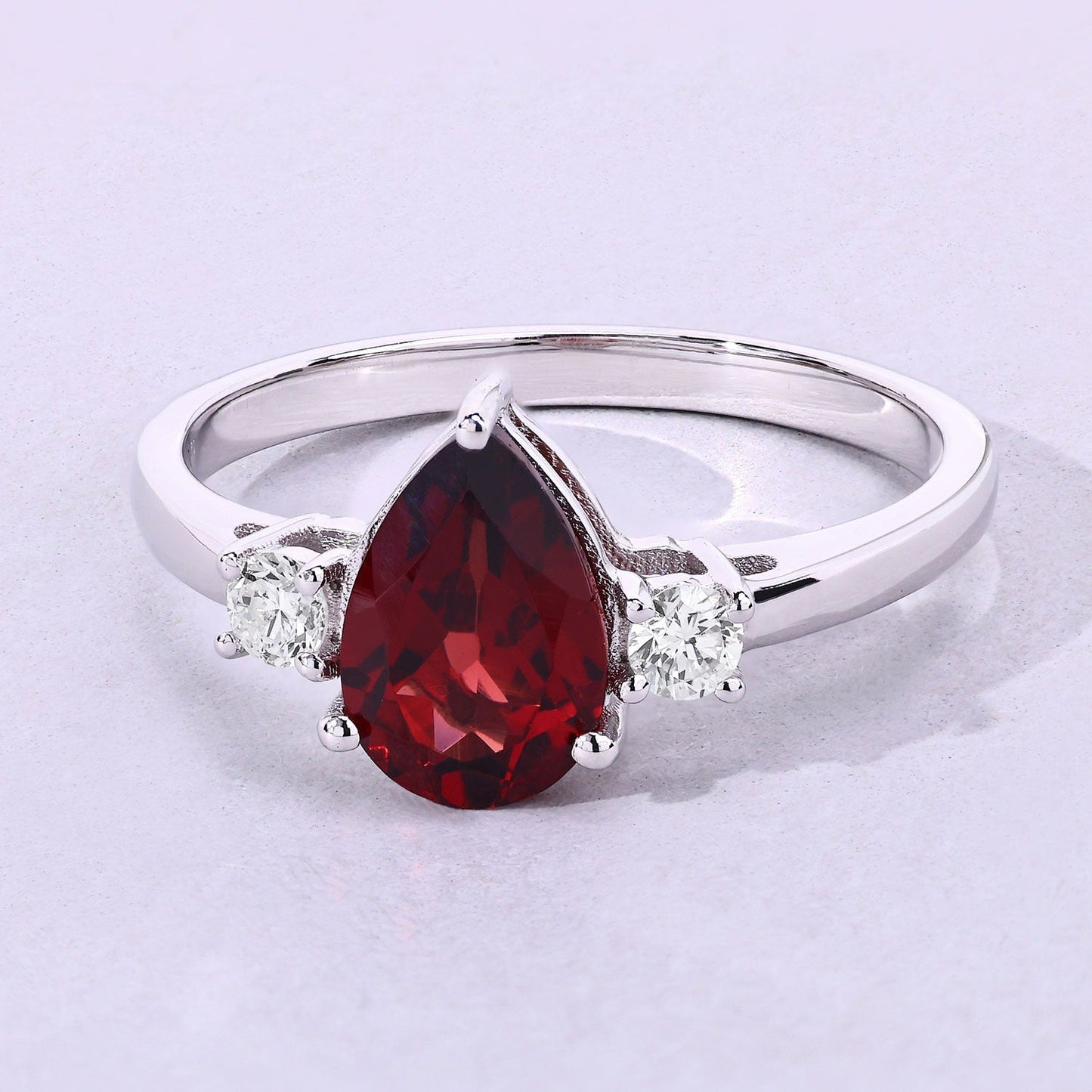 1.30 Ct Pear Red Mozambique Garnet and Lab Diamond Prong Silver Three Stone Ring