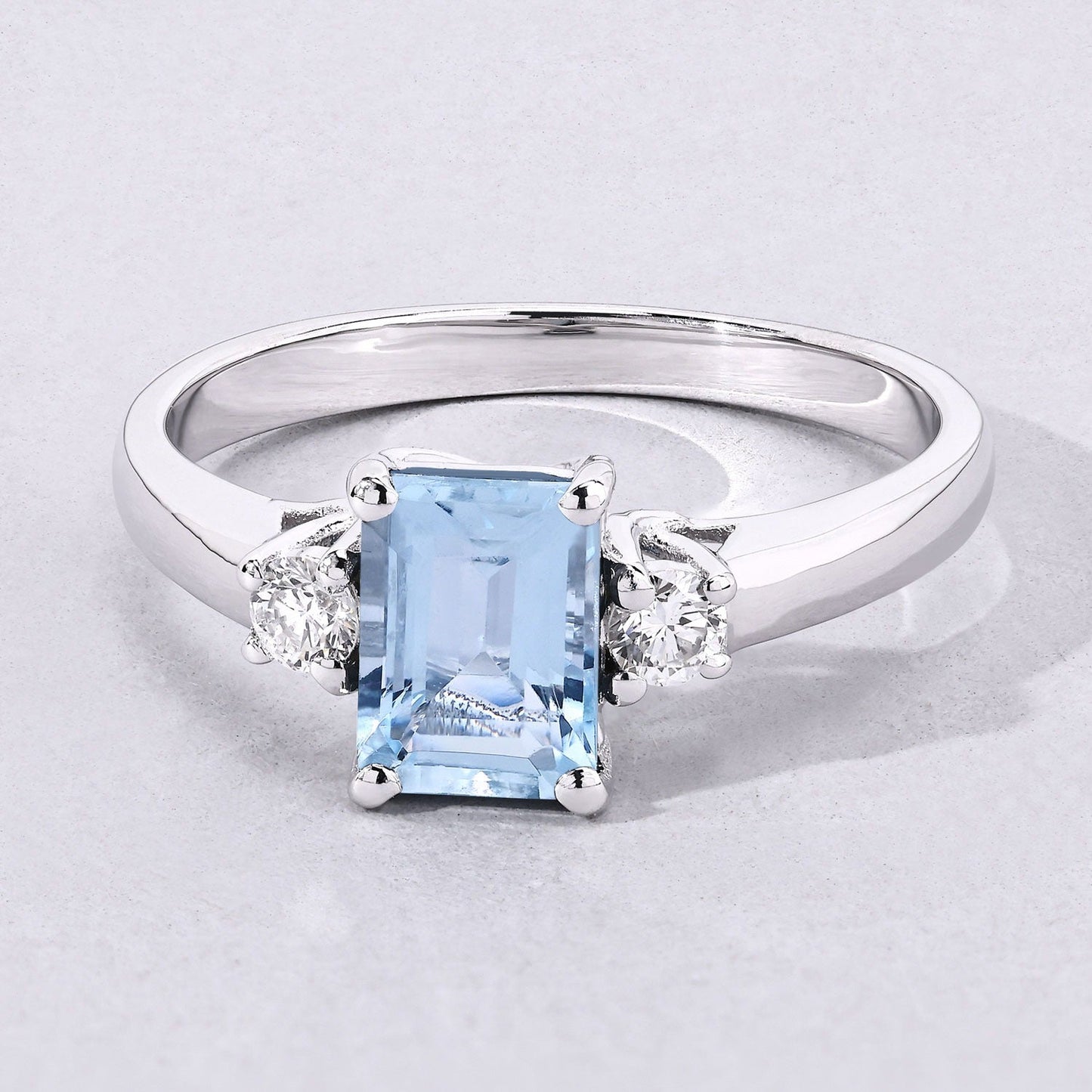 0.80 Ct Octagon Blue Aquamarine and Lab Diamond Prong Silver Three Stone Ring