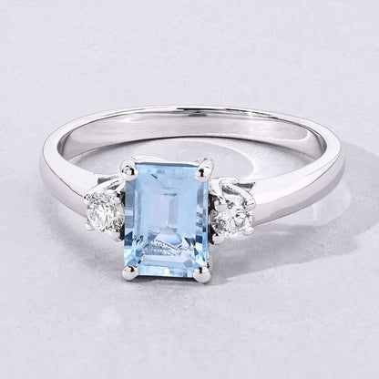 0.80 Ct Octagon Blue Aquamarine and Lab Diamond Prong Silver Three Stone Ring