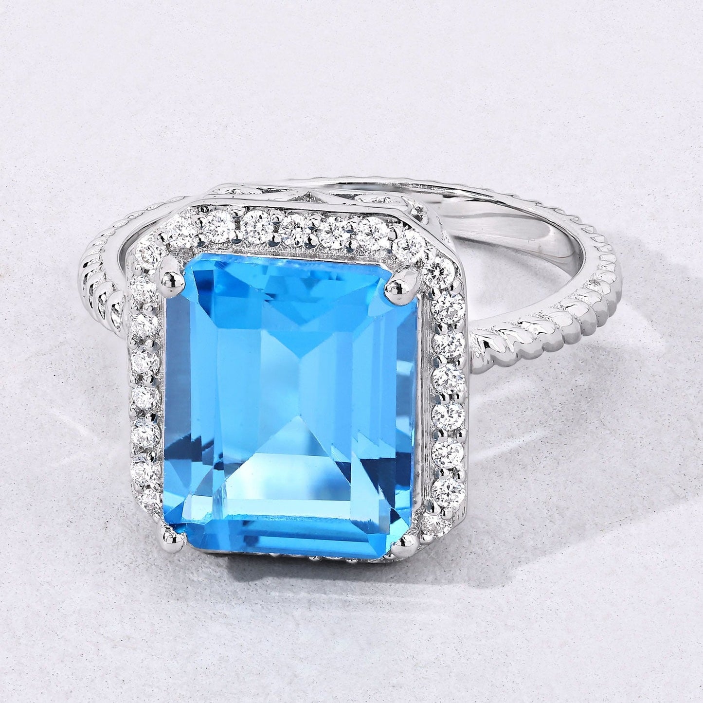 5.45 Ct Octagon Swiss Blue Topaz and Lab Diamond Prong Silver Halo Ring