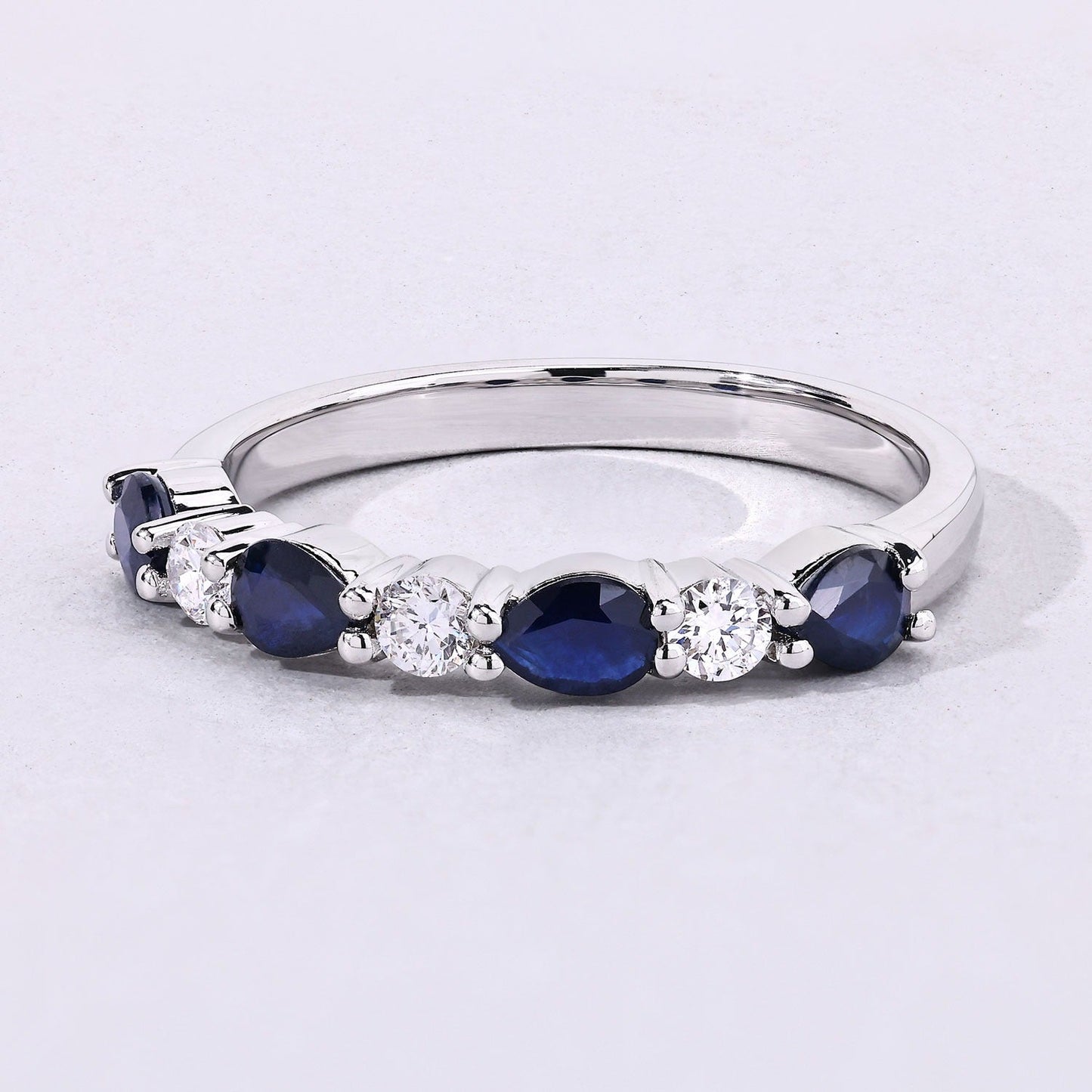 0.80 Ct Pear Blue Sapphire and Lab Diamond Prong Silver Seven Stone Half Eternity Ring