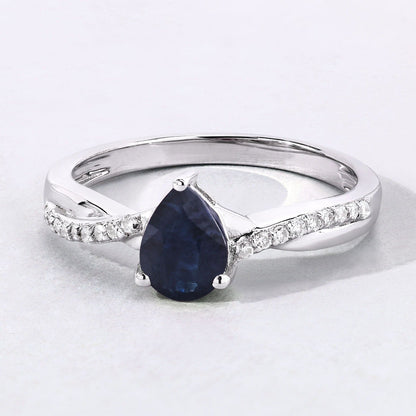 0.80 Ct Pear Blue Sapphire and Lab Diamond Prong Silver Pave Crossover Ring
