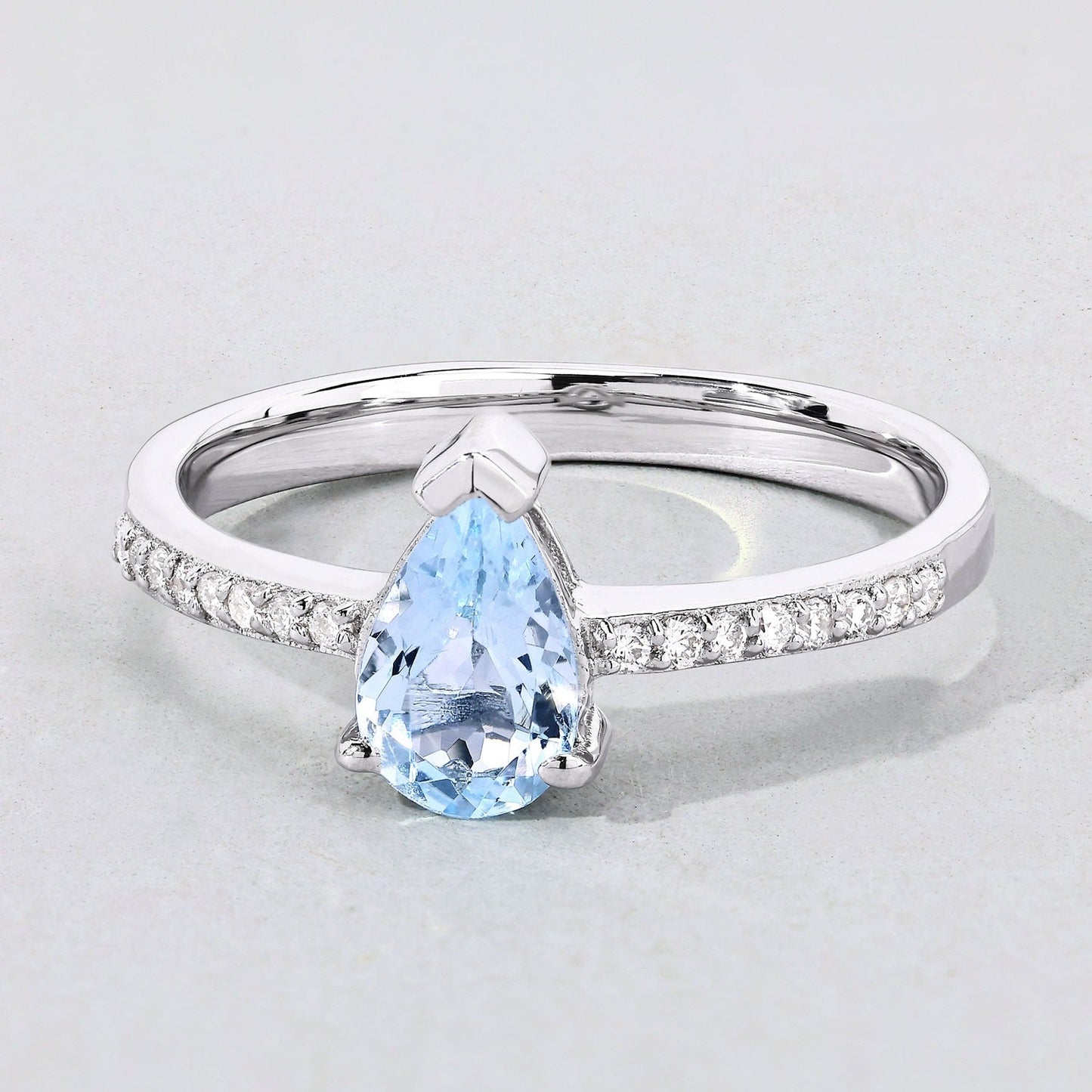 0.80 Ct Pear Blue Aquamarine and Lab Diamond V-Prong Silver Pave Bridge Ring