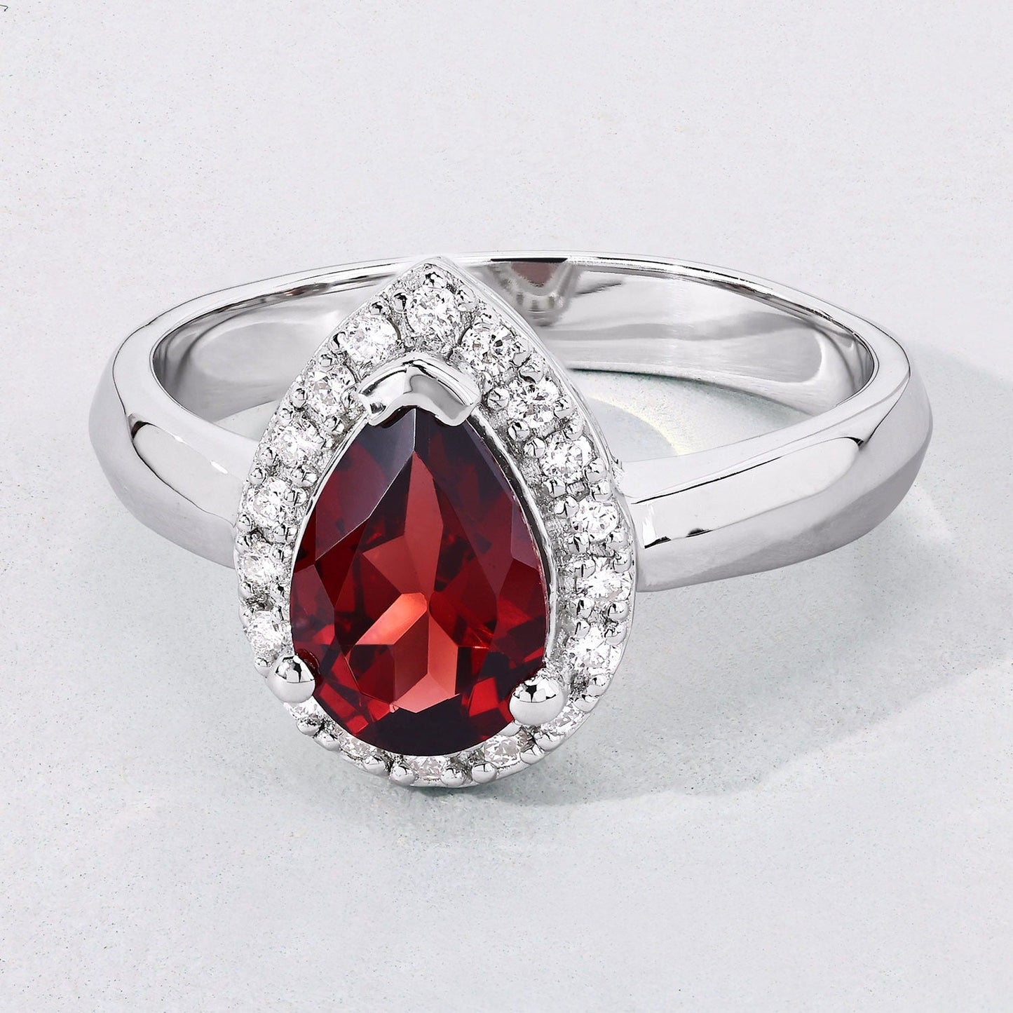 1.30 Ct Pear Red Mozambique Garnet & Lab Diamond Prong Silver Halo Ring