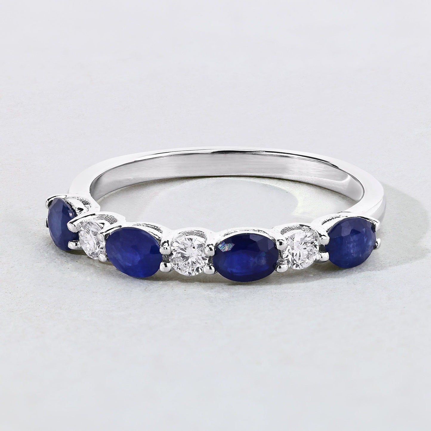 0.88 Ct Oval Blue Sapphire & Lab Diamond Prong Silver Half Eternity Seven Stone Ring