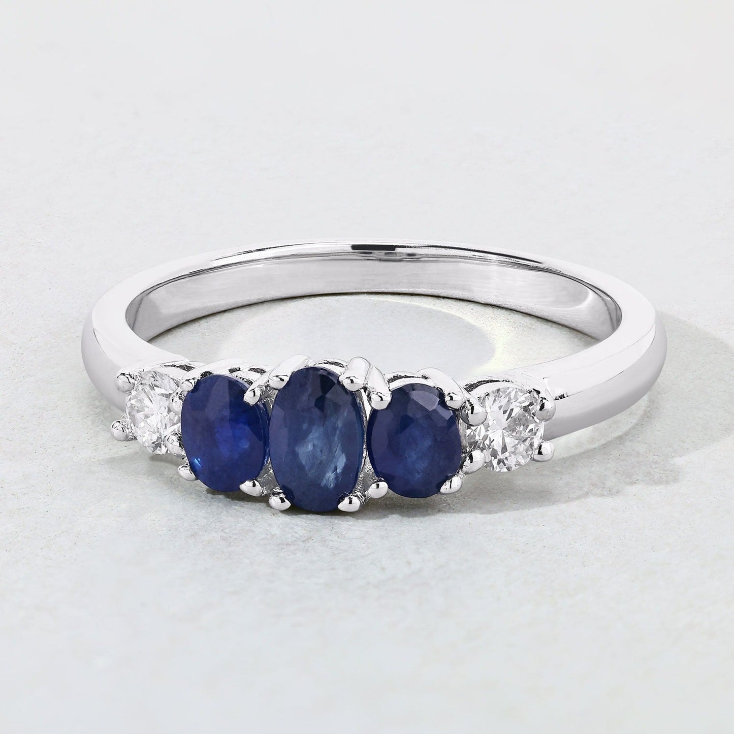 0.69 Ct Oval Blue Sapphire & Lab Diamond Prong Silver Graduated Five Stone Ring