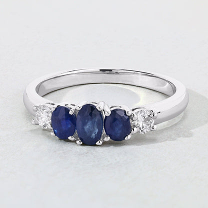 0.69 Ct Oval Blue Sapphire & Lab Diamond Prong Silver Graduated Five Stone Ring