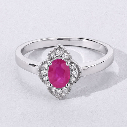0.52 Ct Oval Pink Mozambique Ruby & Lab Diamond Prong Silver Floral Halo Ring