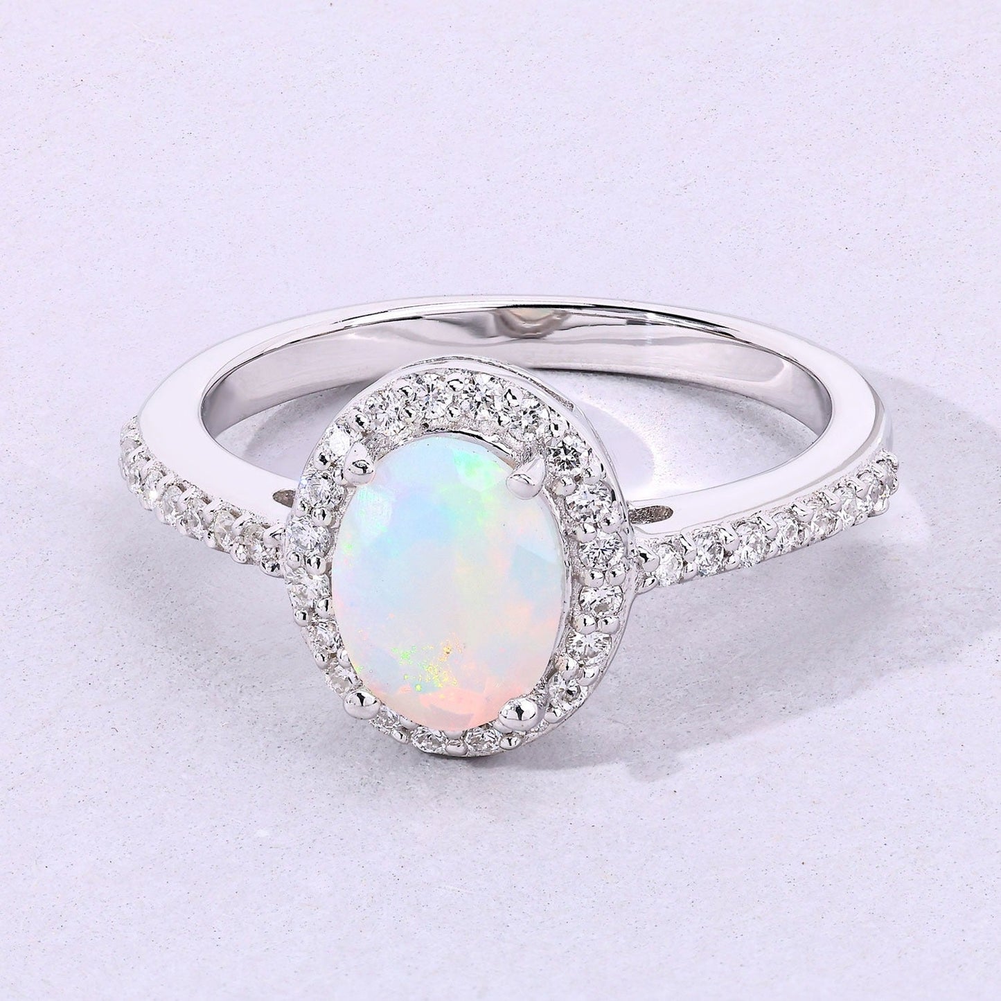 0.65 Ct Oval White Ethiopian Opal and Lab Diamond Prong Silver Halo Pave Ring