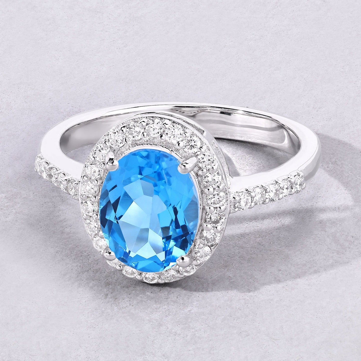2 Ct Oval Swiss Blue Topaz and Lab Diamond Prong Silver Halo Pave Ring
