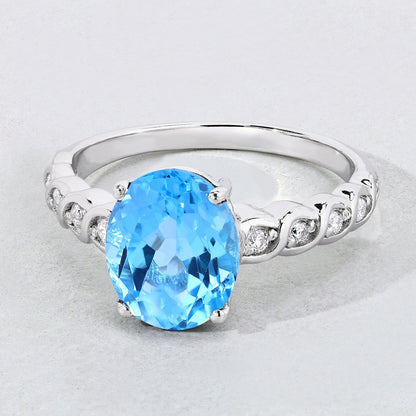 2.55 Ct Oval Swiss Blue Topaz and Lab Diamond Prong Silver Bridge Ring