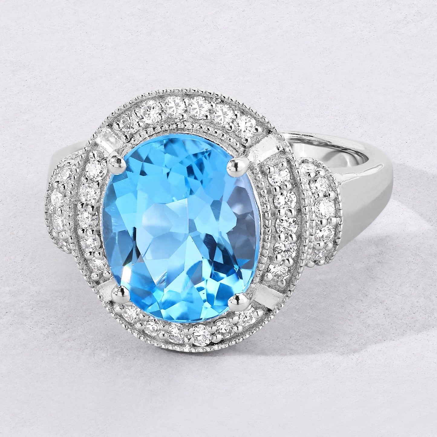 4 Ct Oval Swiss Blue Topaz and Lab Diamond Silver Halo Statement Ring
