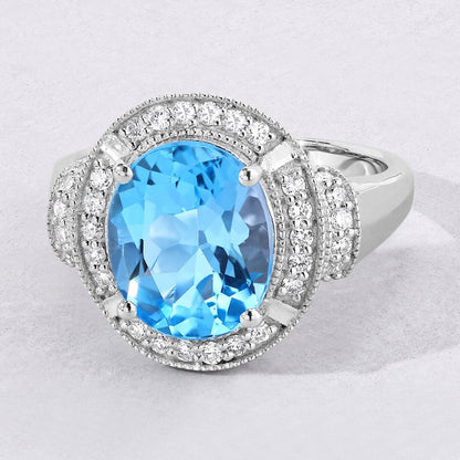 4 Ct Oval Swiss Blue Topaz and Lab Diamond Silver Halo Statement Ring