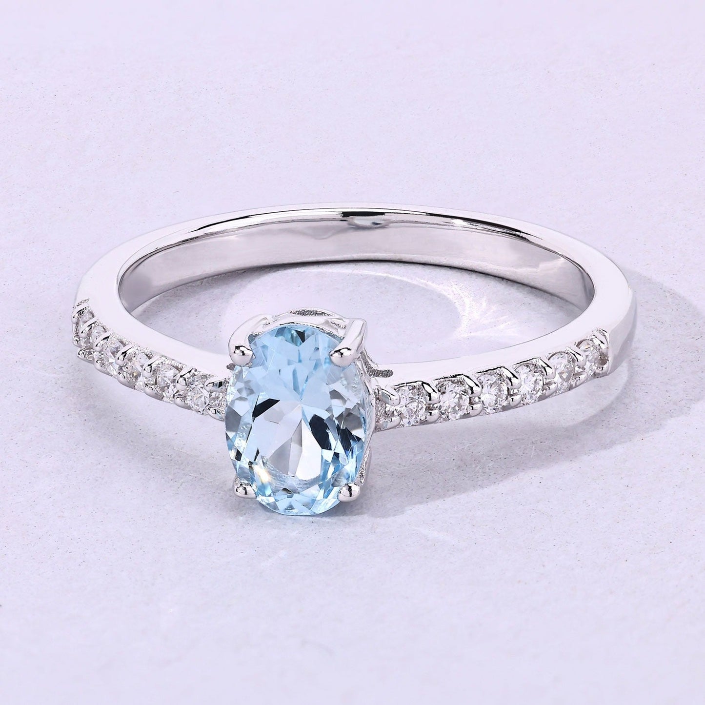 0.60 Ct Oval Blue Aquamarine and Lab Diamond Prong Silver Pave Band Ring