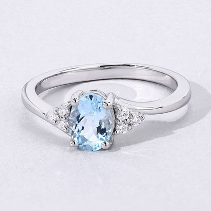 0.60 Ct Oval Blue Aquamarine and Lab Diamond Prong Sterling Silver Bypass Ring