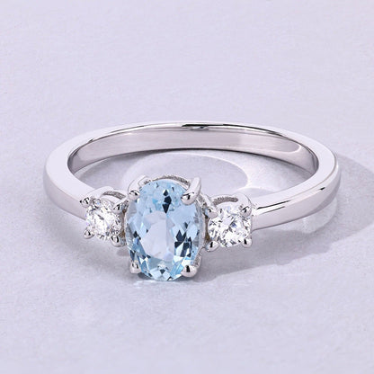 0.60 Ct Oval Blue Aquamarine and Lab Diamond Prong Silver Three Stone Ring