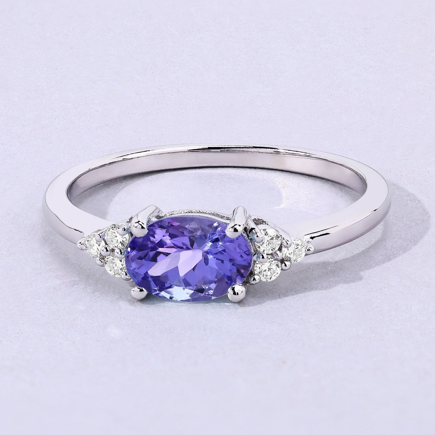 0.75 Ct Oval Violet Tanzanite and Lab Diamond Prong Silver Cocktail Ring