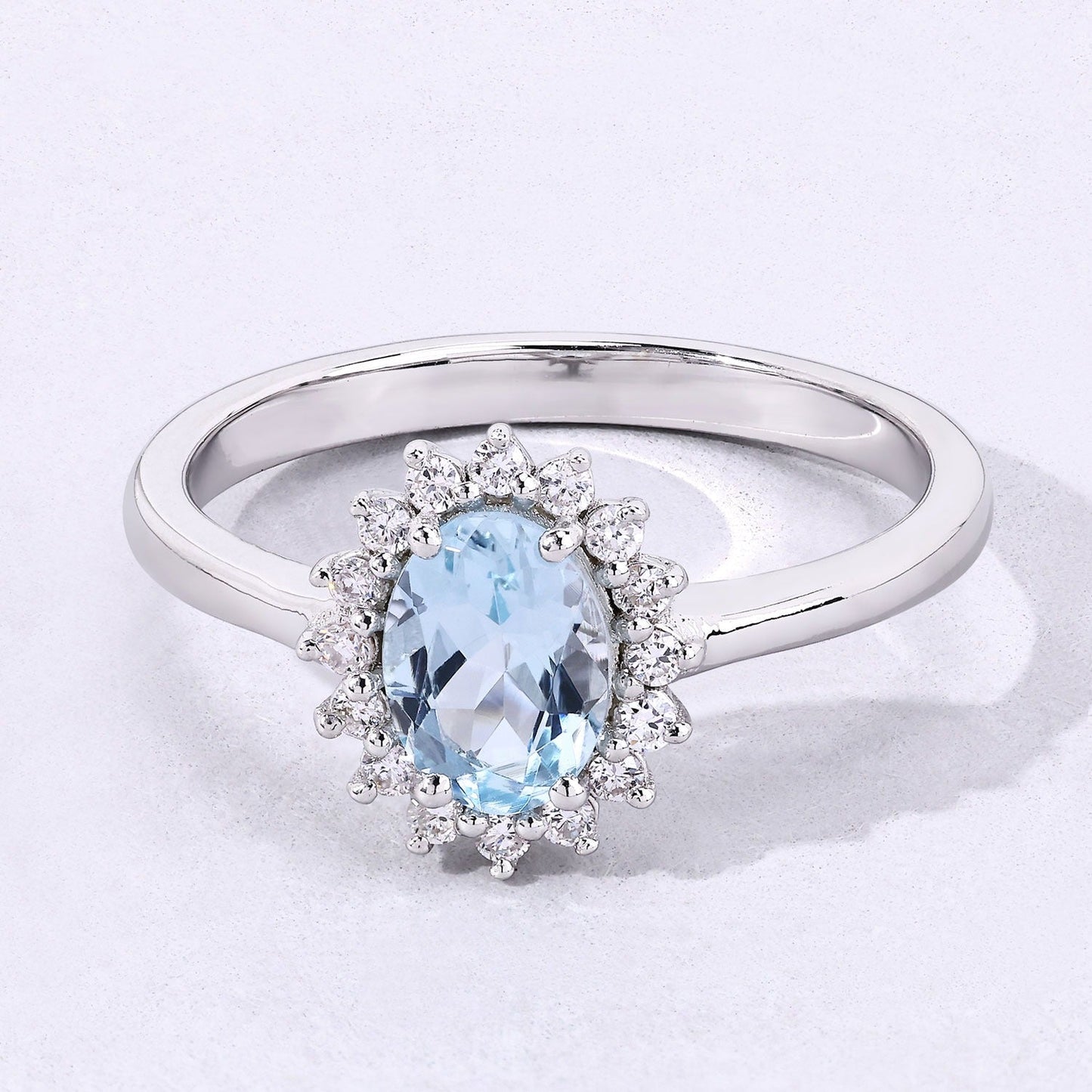 0.60 Ct Oval Blue Aquamarine and Lab Diamond Prong Sterling Silver Halo Ring