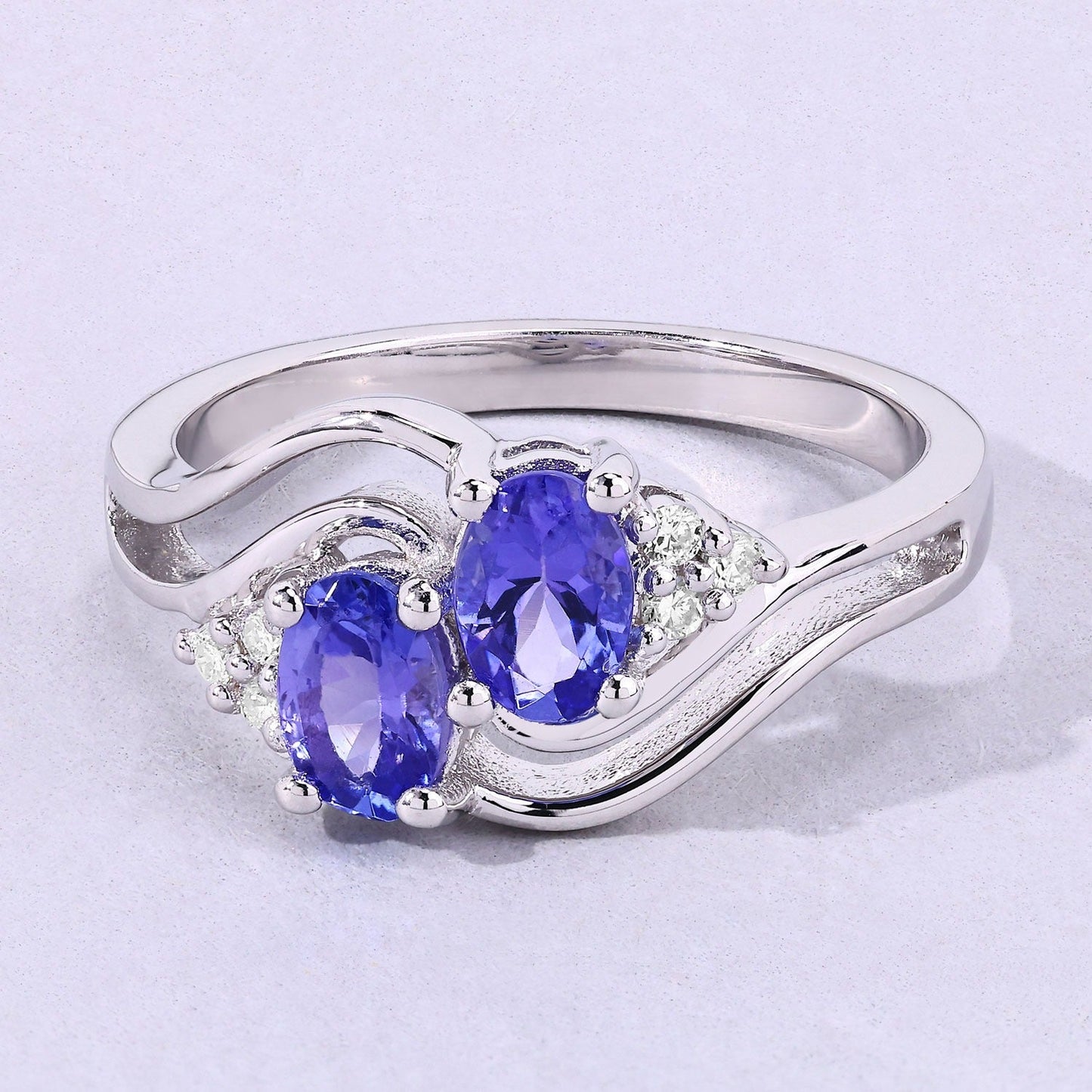 0.88 Ct Oval Violet Tanzanite and Lab Grown Diamond Prong Silver Bypass Ring