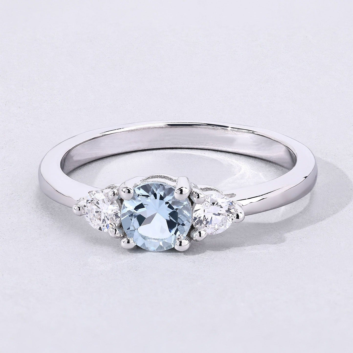 0.38 Ct Round Blue Aquamarine and Lab Diamond Prong Silver Three Stone Ring