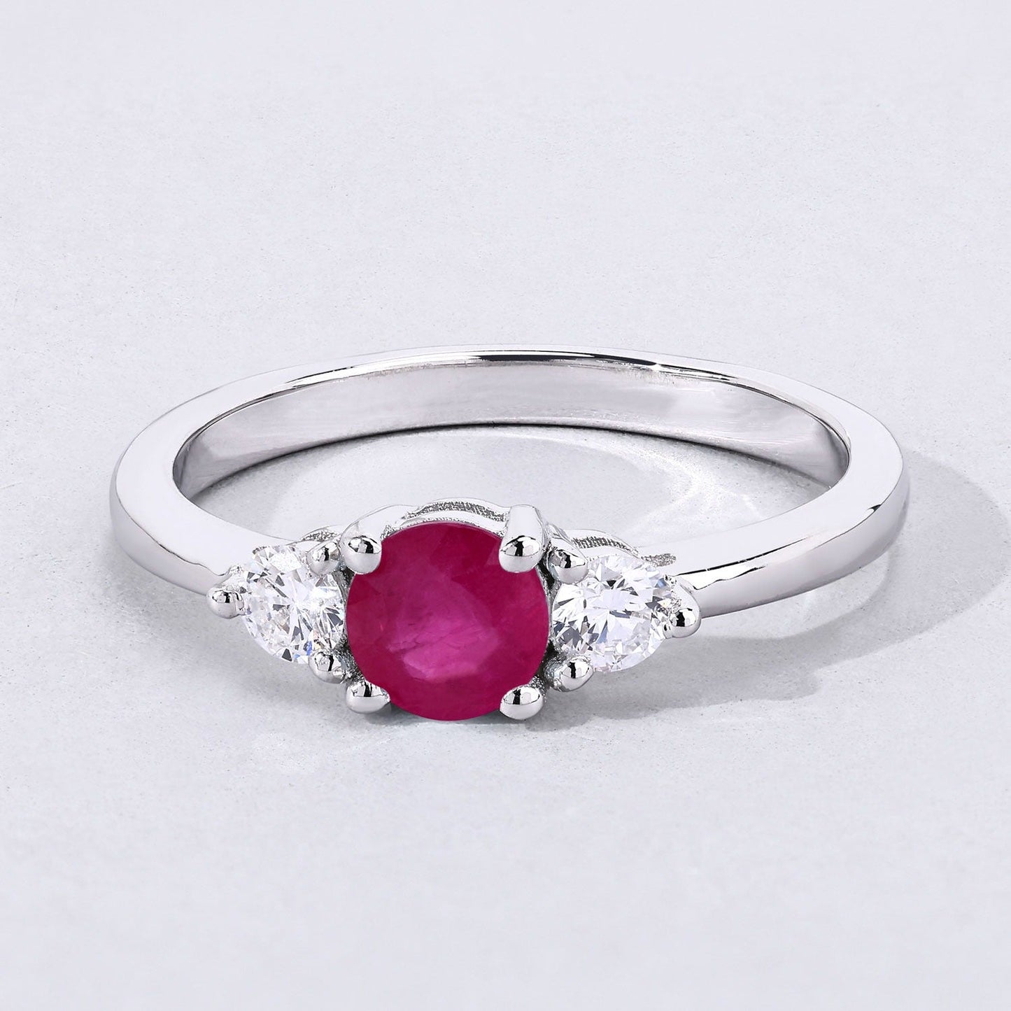 0.55 Ct Round Pink Mozambique Ruby & Lab Diamond Prong Silver Three Stone Ring