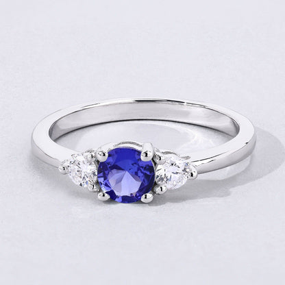 0.47 Ct Round Violet Tanzanite & Lab Diamond Prong Silver Three Stone Ring