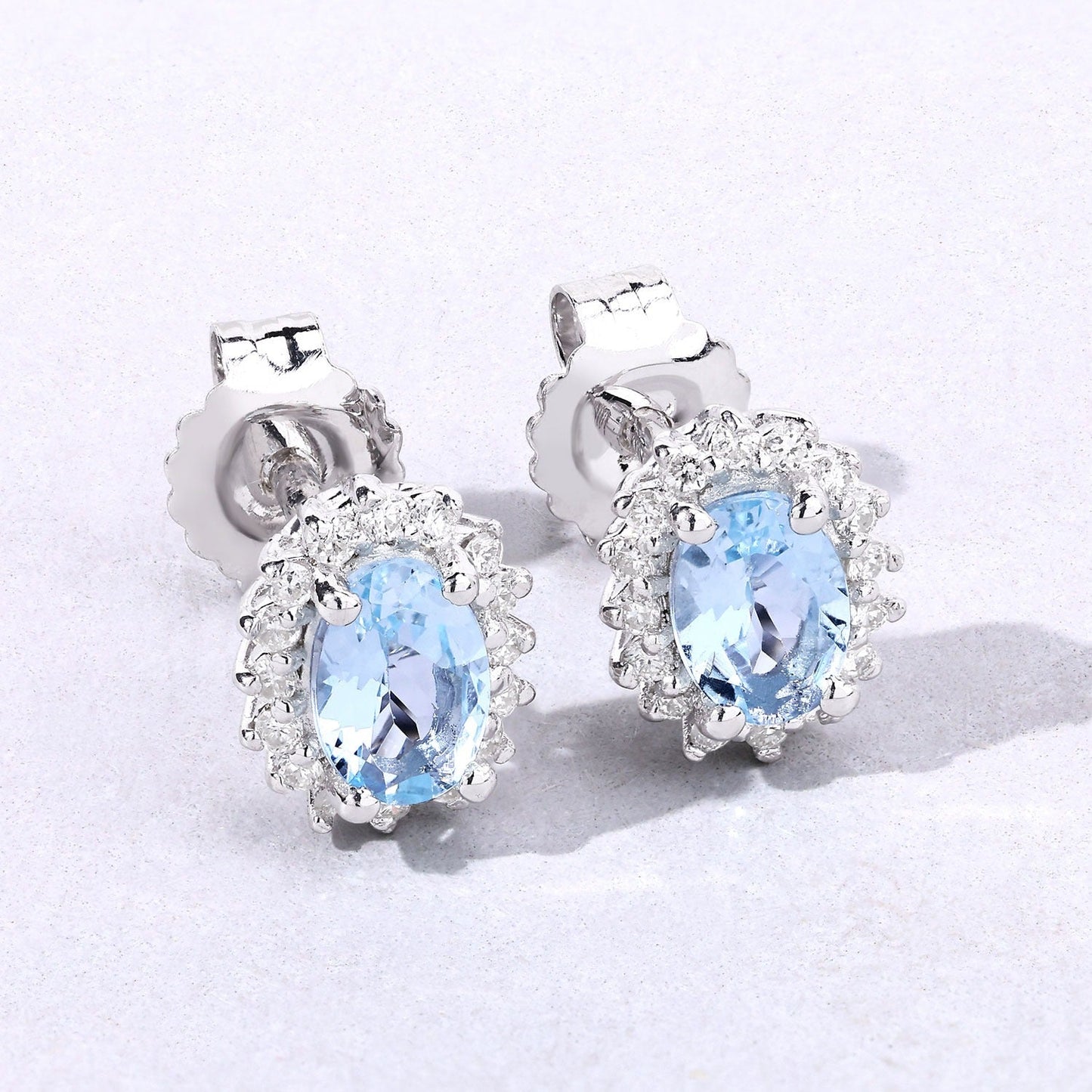 0.80 Ct Oval Blue Aquamarine & Lab Diamond Prong Silver Halo Basket Stud Earrings