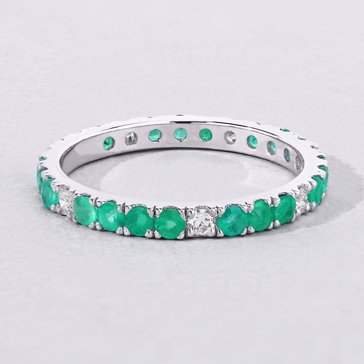 0.75 Ct Round Green Zambian Emerald and Lab Diamond Prong Silver Eternity Band Ring
