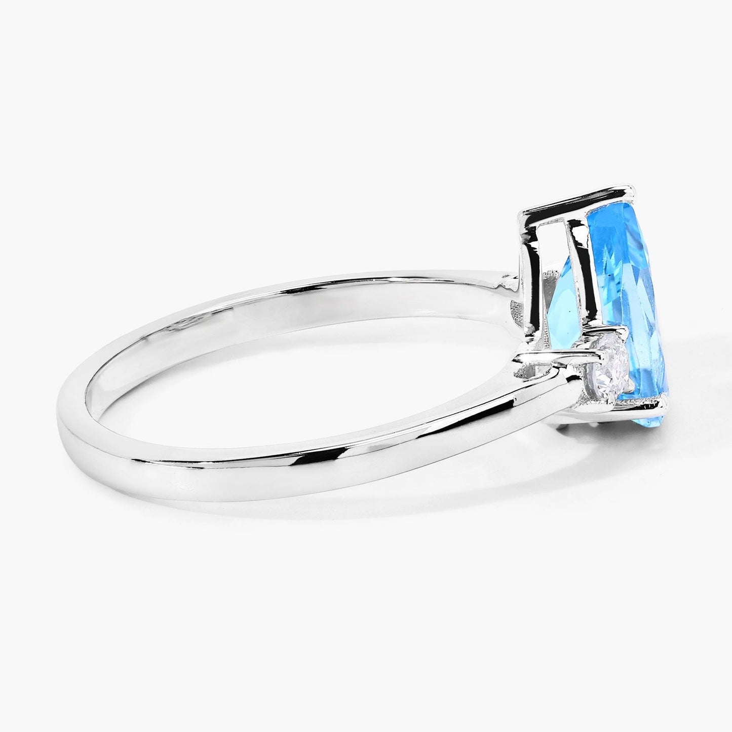 1.30 Ct Pear Swiss Blue Topaz and Lab Diamond Prong Silver Three Stone Ring