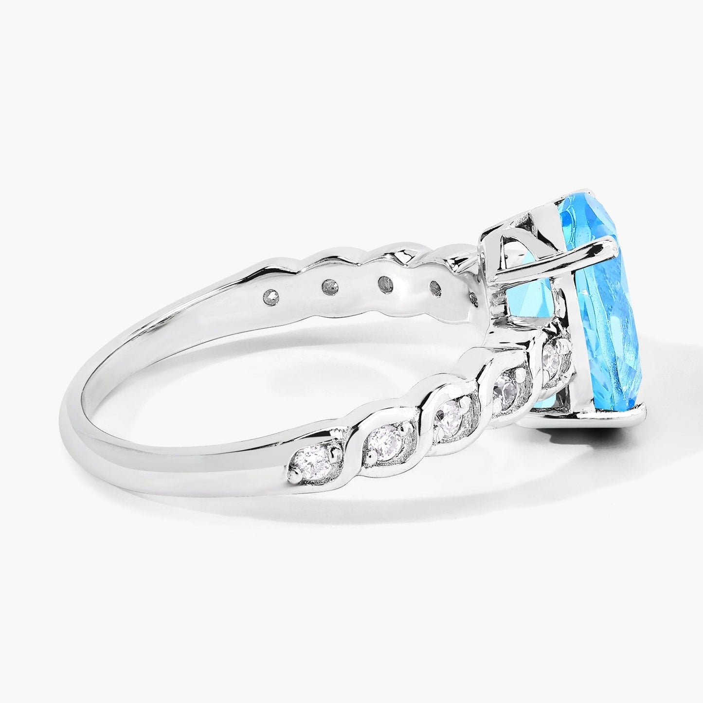 2.55 Ct Oval Swiss Blue Topaz and Lab Diamond Prong Silver Bridge Ring