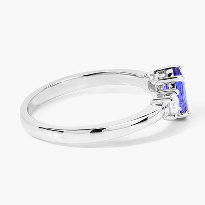 0.75 Ct Oval Violet Tanzanite and Lab Diamond Prong Silver Three Stone Ring