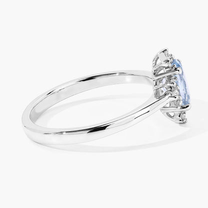 0.60 Ct Oval Blue Aquamarine and Lab Diamond Silver Halo Statement Ring