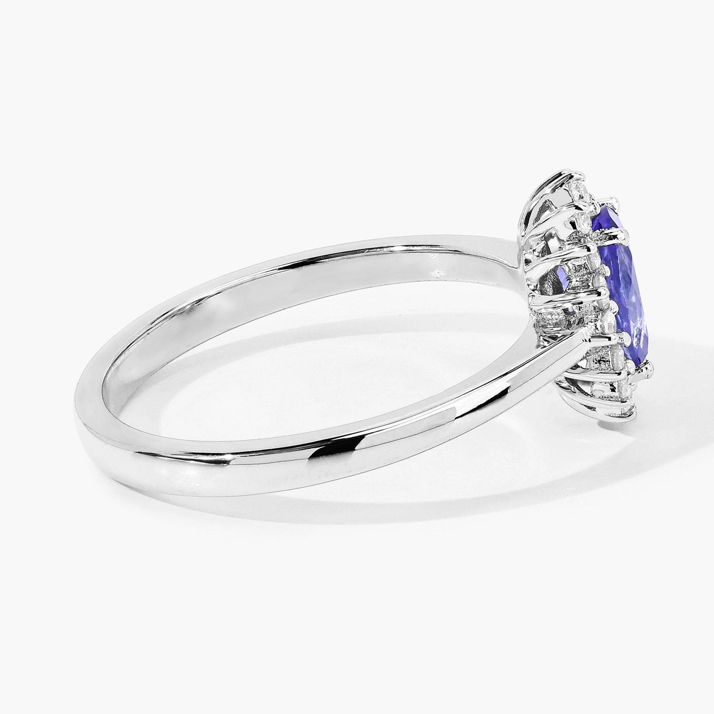 0.75 Ct Oval Violet Tanzanite and Lab Grown Diamond Prong Silver Halo Ring