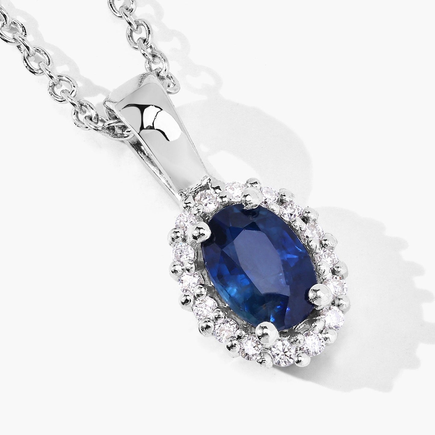 0.55 Ct oval Blue Sapphire and Lab Diamond prong Silver Halo pendant Necklace