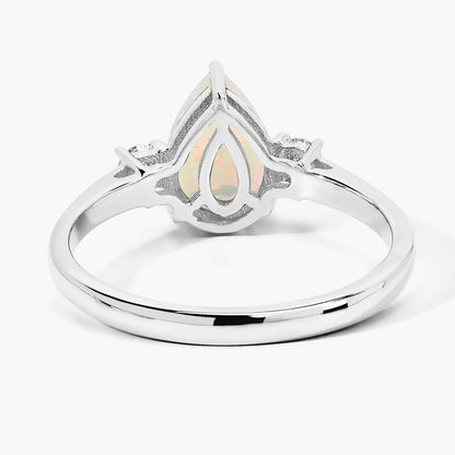 0.90 Ct Pear White Ethiopian Opal and Lab Diamond Prong Silver Three Stone Ring