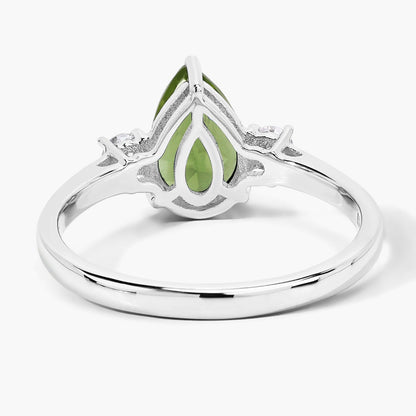 1.10 Ct Pear Green Peridot and Lab Diamond Prong Silver Three Stone Ring