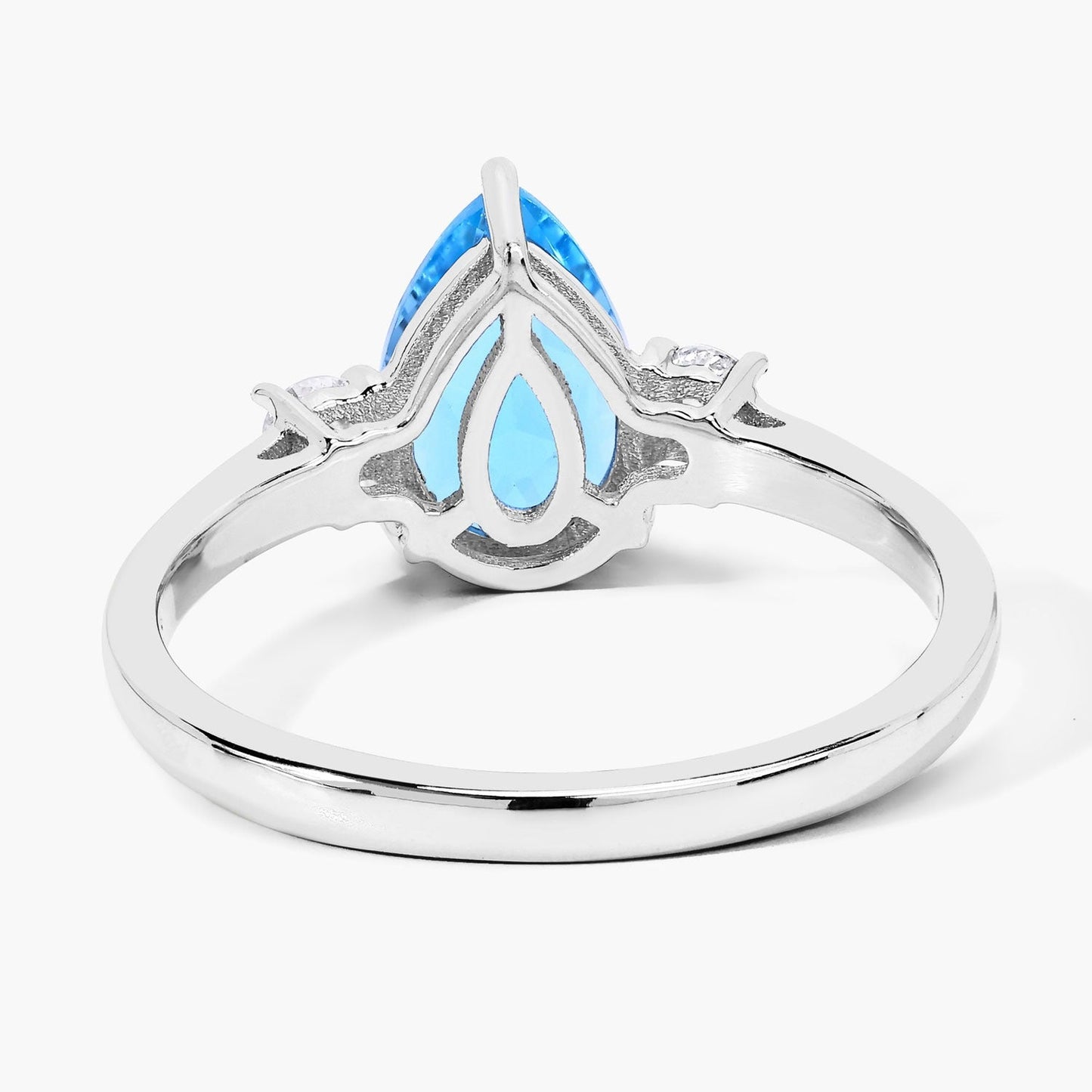 1.30 Ct Pear Swiss Blue Topaz and Lab Diamond Prong Silver Three Stone Ring