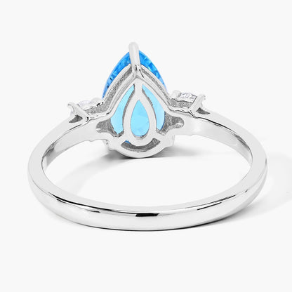1.30 Ct Pear Swiss Blue Topaz and Lab Diamond Prong Silver Three Stone Ring