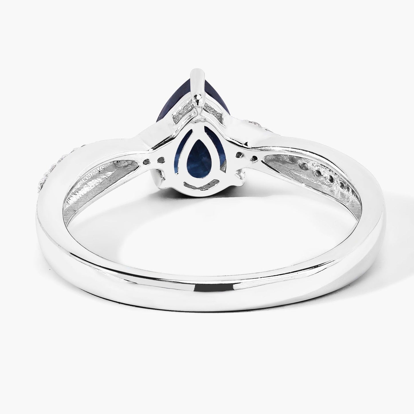 0.80 Ct Pear Blue Sapphire and Lab Diamond Prong Silver Pave Crossover Ring