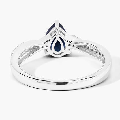 0.80 Ct Pear Blue Sapphire and Lab Diamond Prong Silver Pave Crossover Ring
