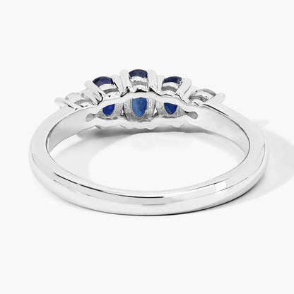 0.69 Ct Oval Blue Sapphire & Lab Diamond Prong Silver Graduated Five Stone Ring