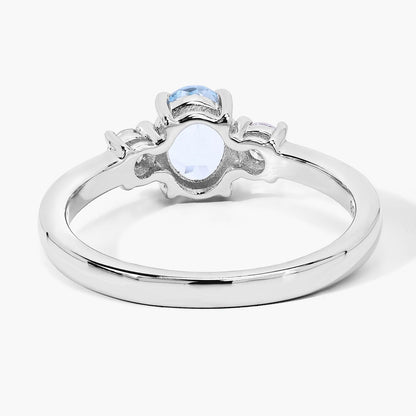 0.60 Ct Oval Blue Aquamarine and Lab Diamond Prong Silver Three Stone Ring