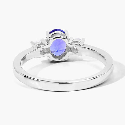 0.75 Ct Oval Violet Tanzanite and Lab Diamond Prong Silver Three Stone Ring