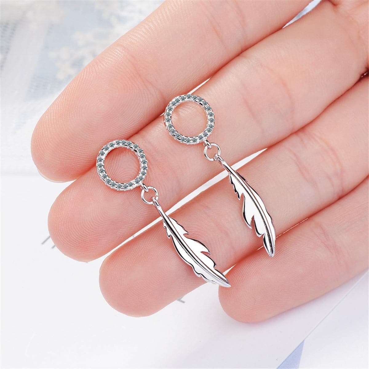 Cubic Zirconia & Silvertone Feather Drop Earrings