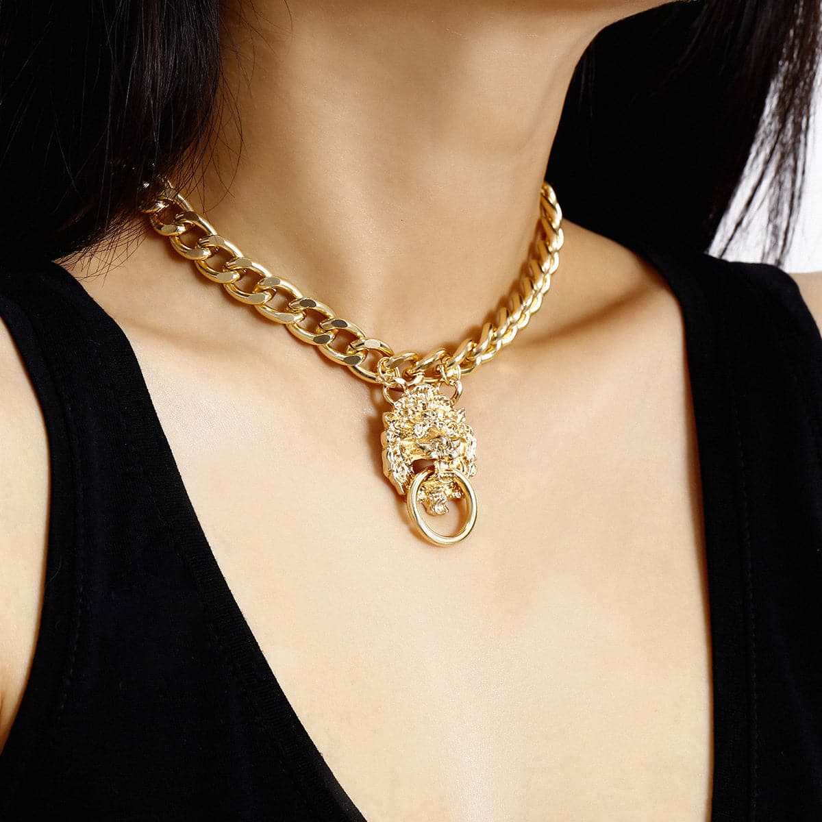 Goldtone Lion Catch Pendant Necklace