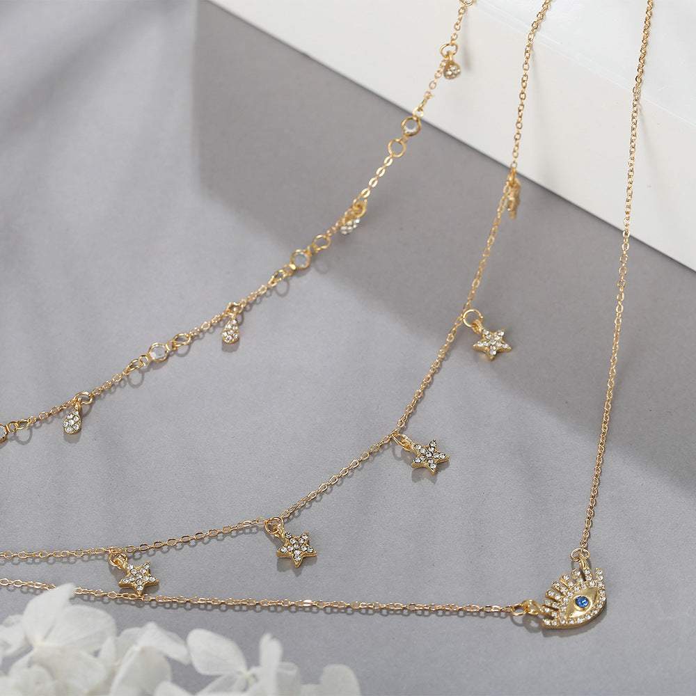 Cubic Zirconia & Goldtone Star & Eye Layered Necklace