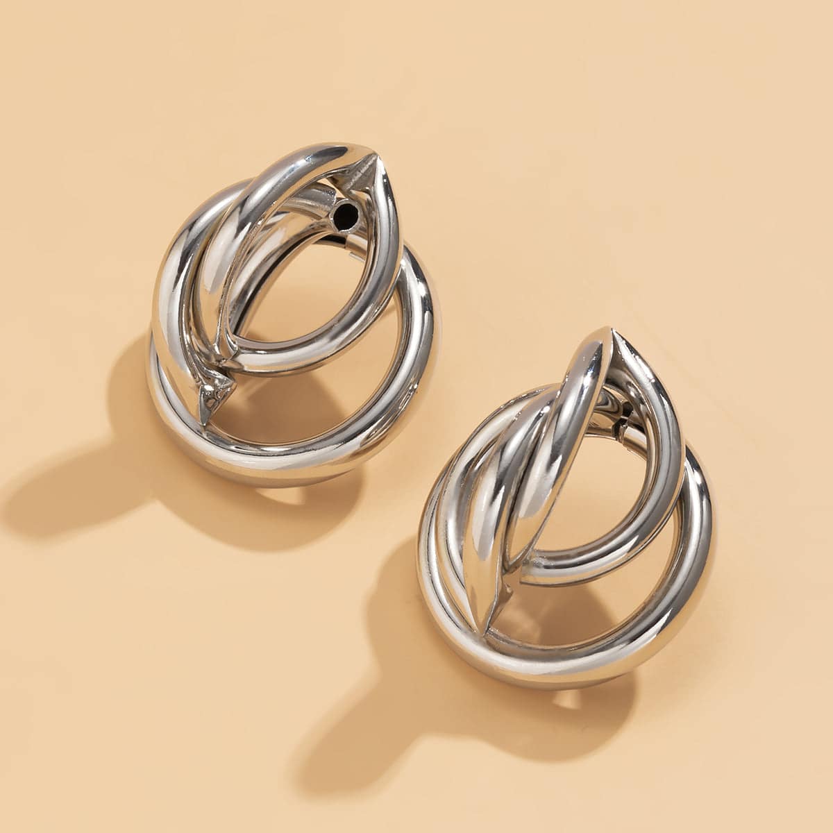 Silvertone Interlocking Rings Stud Earrings