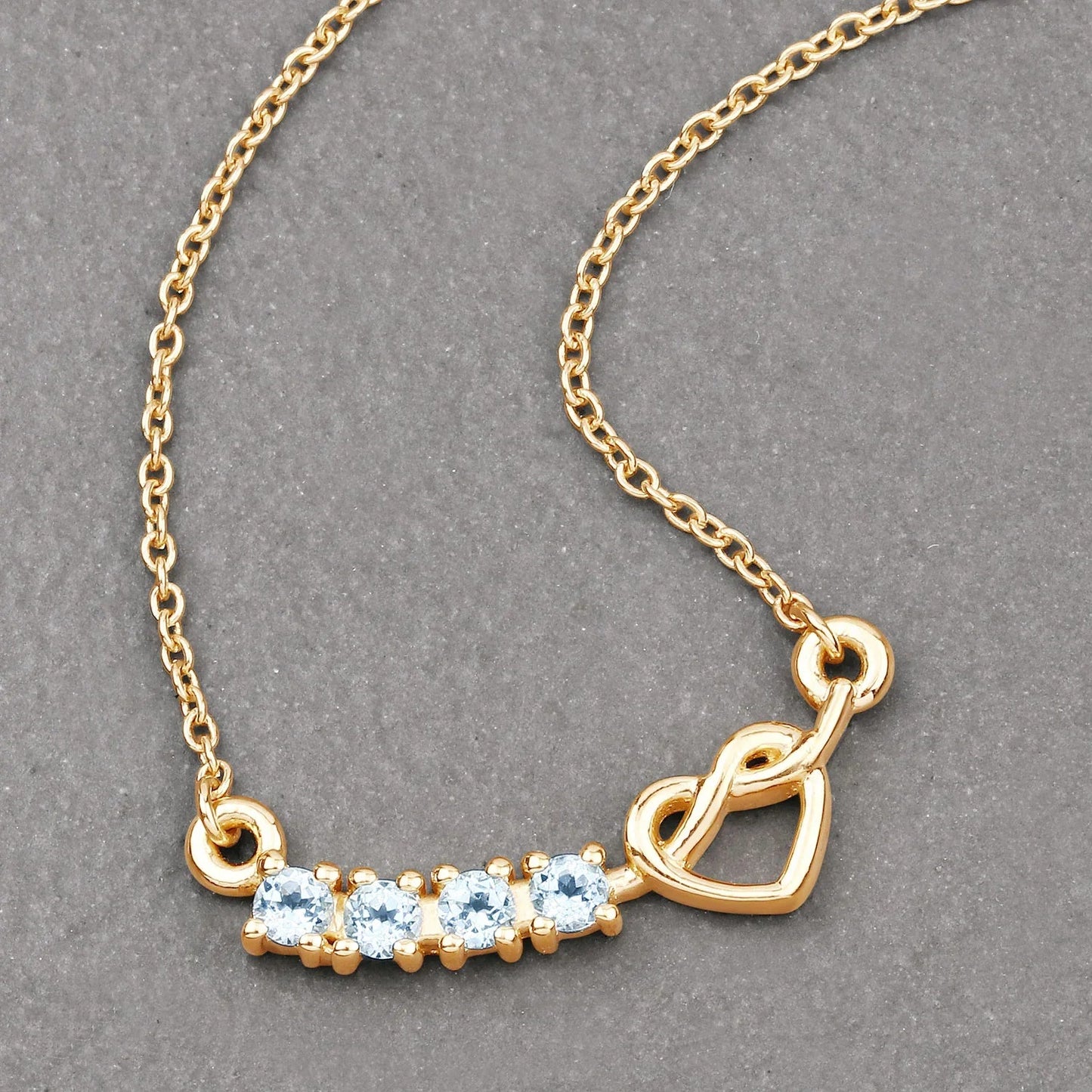 0.30 Ct Round Blue Topaz Prong 18K Gold Plated Silver Heart & Infinity Necklace